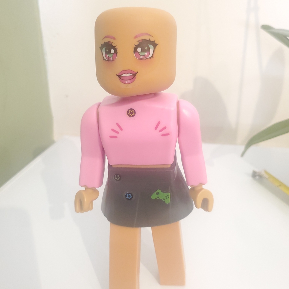 Pink and Black Kids Toy Figure